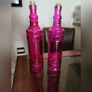 Large pink glass decorative bottles